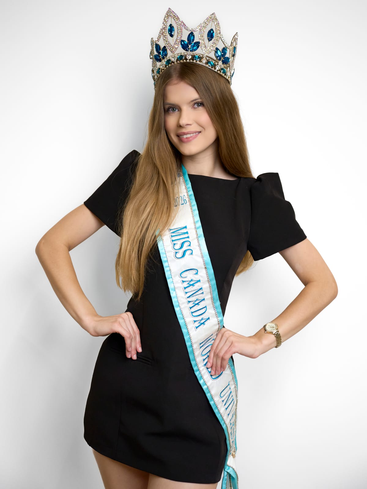 Liliia, co-founder of D&L Modeling Academy, wearing her Miss Canada World Universal crown