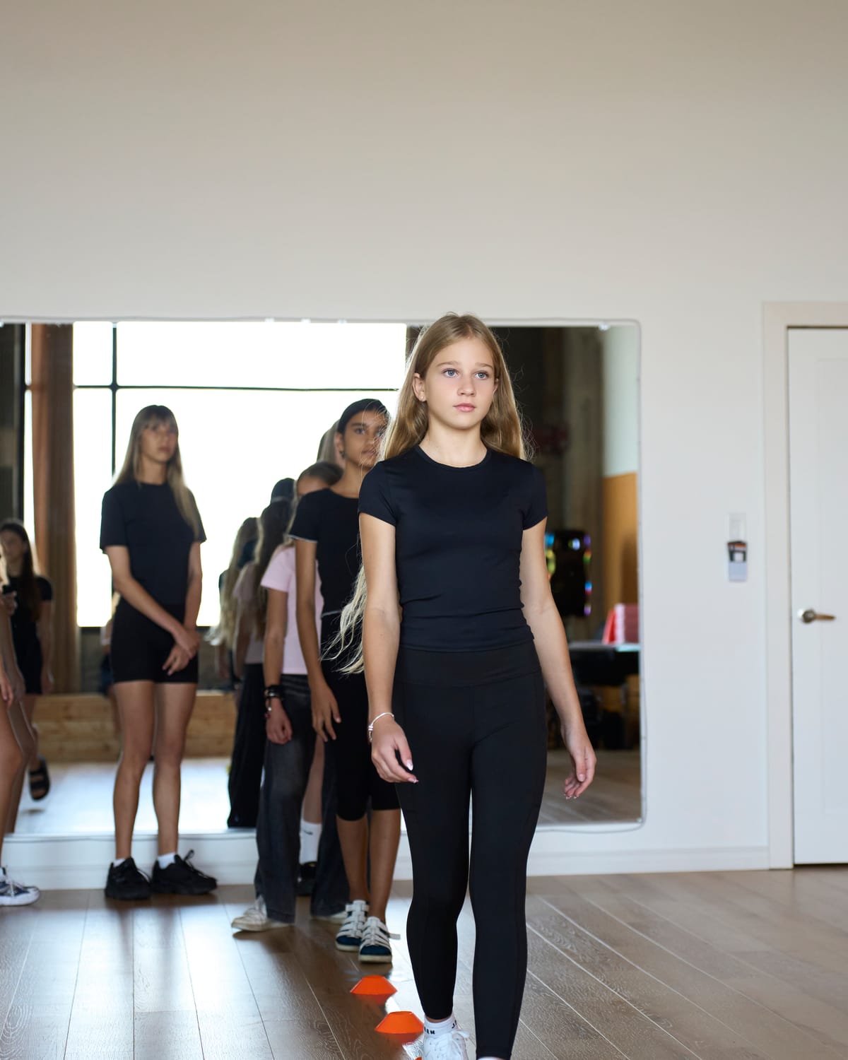 Student walking the runway toward the camera